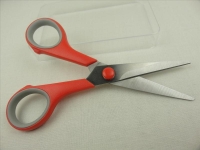 Scissors with red plastic handle