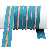 Endless zippers model "Brilliant" No. 7 with rose gold spiral petrol