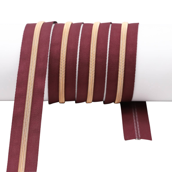 Endlos- Reißverschlüsse Modell "Brilliant" Nr. 7  mit roségoldener Spirale bordeaux