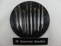 Sewing needles with gold eyes